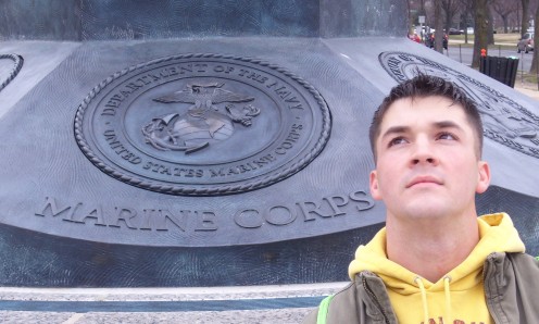 My son with the emblem of the branch in which he chose to serve, The United States Marine Corps Eagle, Globe, and Anchor.  Semper Fi!