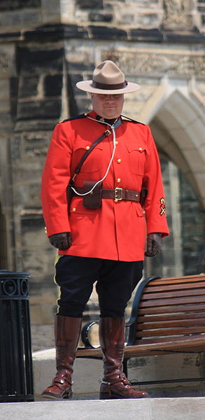 An officer of the Royal Canadian Mounted Police (a "Mountie") standing guard on Parliament Hill in Ottawa, Ontario