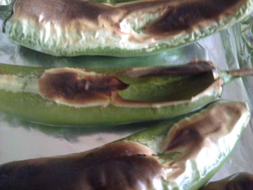 As they roast, the skin will begin to blister and pop.  Keep a close eye on them as they will roast in mere minutes.
