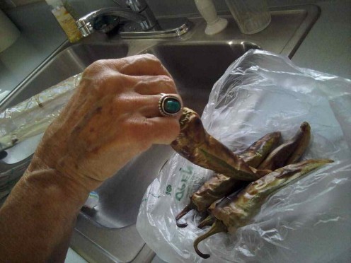Remove the peppers from the pan and place into a plastic baggy.  This helps the skin peel off easier!