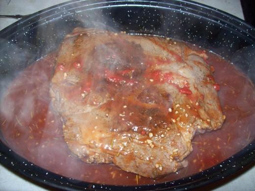 The roast after the liquid mixture has been poured over it.