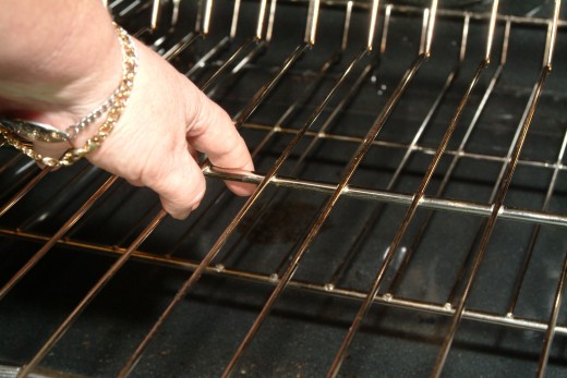 Remove the racks and place them in the soaking formula while you green clean the oven interior surfaces.