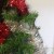 Now with this line of tinsel start on the other end you started from last time, just to be different and aim for the gap in between the red tinsel you did previously. Now..... Now with this line of tinsel start on the other end you started from last time, just to be different and aim for the gap in between the red tinsel you did previously. Now.....