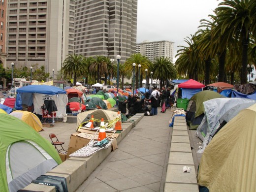 View of Occupy San Francisco, facing North. I'm standing on the pony wall, just above the black plastic homeless tent and the mustard yellow blanketed man. 
