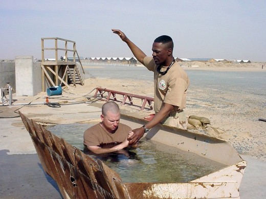 US Navy chaplain administers baptism in Iraq. Definitely not salvation by works, but doing nothing is a sin, and that does not lead to salvation.