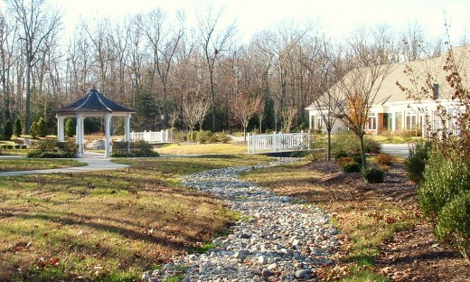 There is a walking path, gazebo, water features and garden in the back of the center and each of the patient rooms have double wide doors looking out on the gardens, plus a semi-private concrete patio where wheelchairs and/or beds can be rolled out.