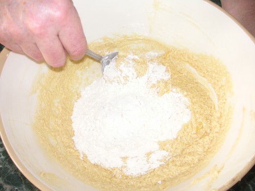 Add The Flour and Salt And Begin To Fold In To The Mixture Using a Metal Spoon.