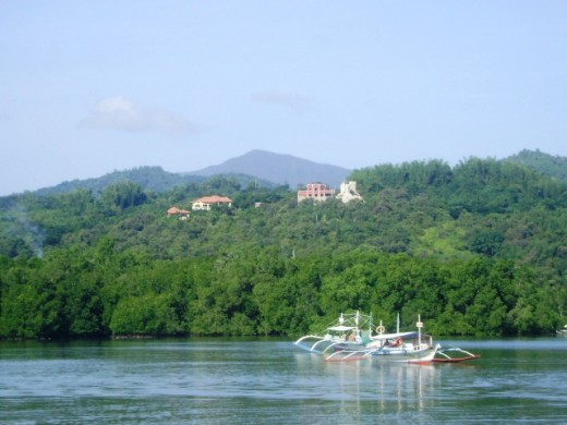 Outtriger boats taking the tourists to the Island Hopping Experience at Honda Bay