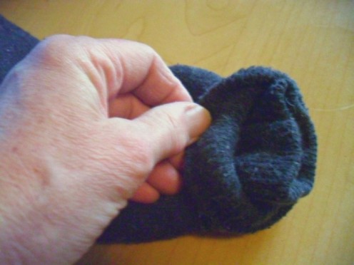 Two socks are used to make this plush dog toy by placing one sock inside the other it makes the head and body thicker.