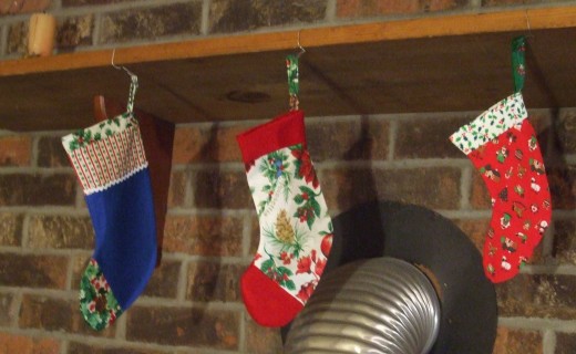 Aaaw...don't these little stockings look SO cute hanging from the mantle?