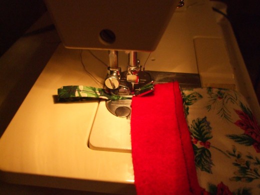 Sew the folded loop onto the edge of one of the stocking sides.