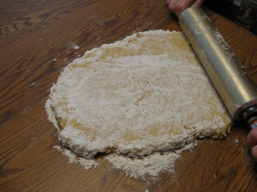 Roll dough from the center outward.