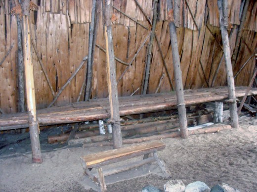 Benches line each side of the structure.  They are made of birch trees and bark.