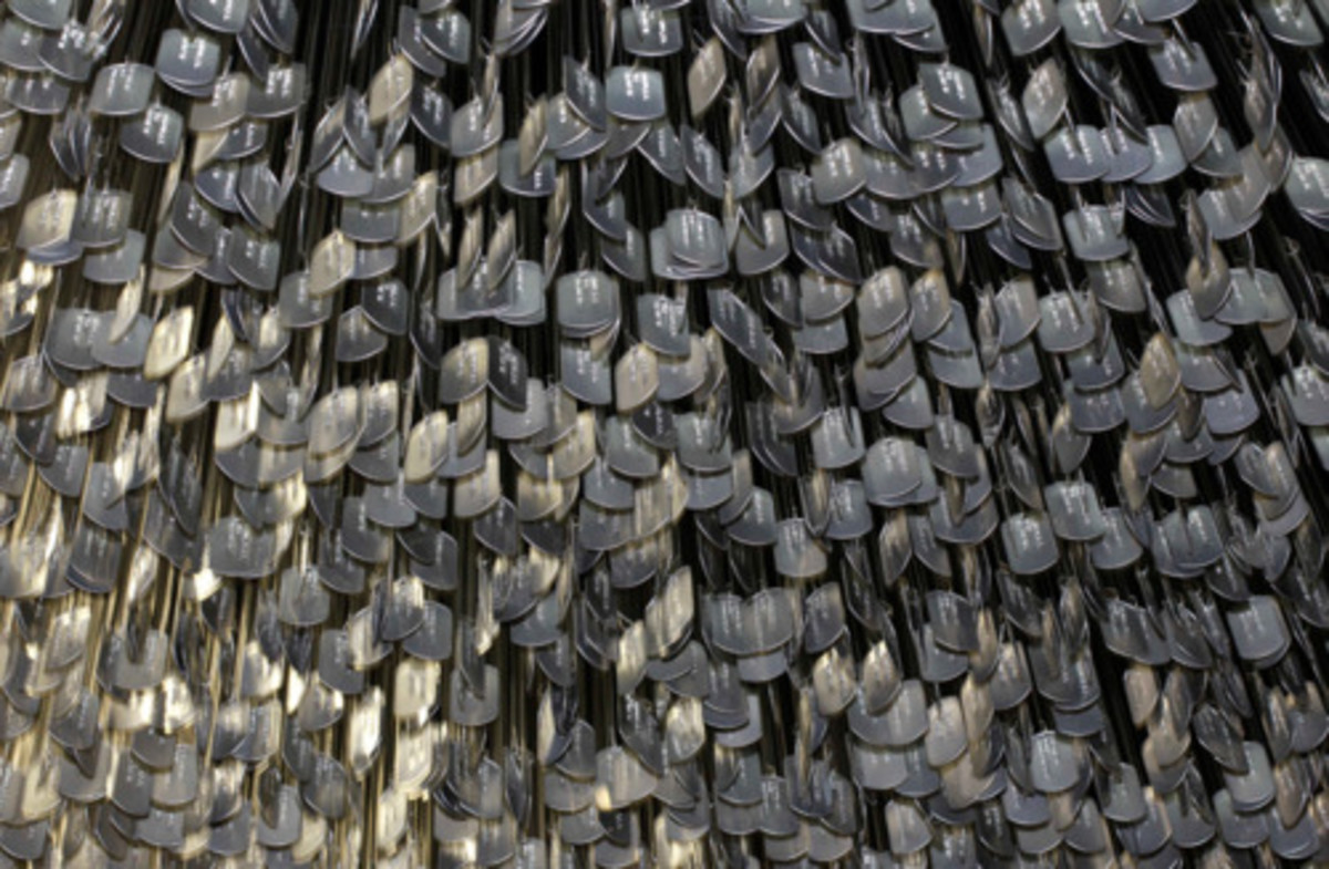Dog tags of 58211 American Vietnam War dead hanging from ceiling of Vietnam Vet museum in Chicago.