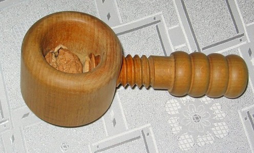 Basic Wooden Nutcracker, using a screw to crack the nut.  