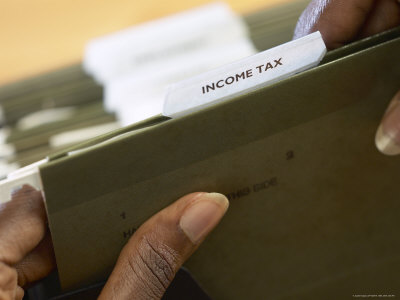 Woman Holding Income Tax Folder