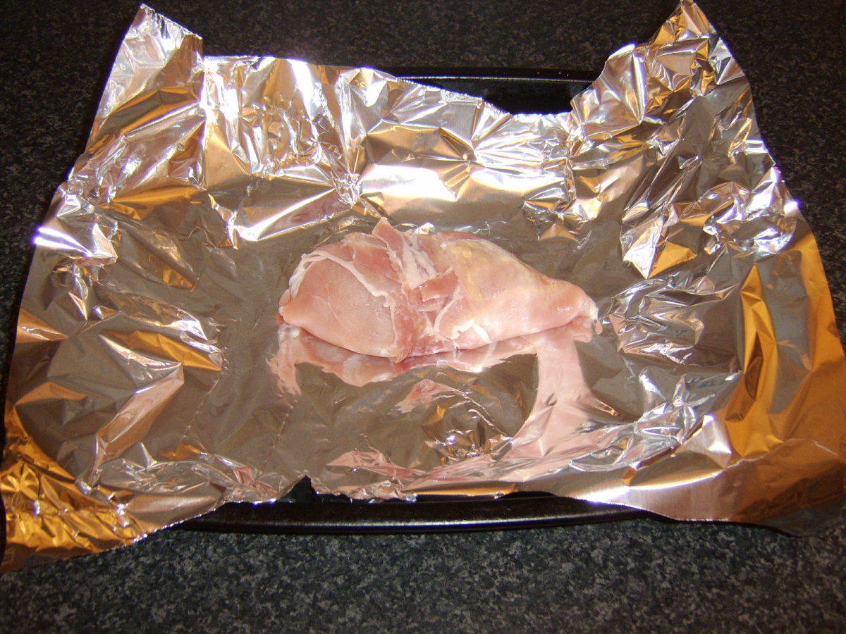 Chicken parcel is wrapped in foil for the oven