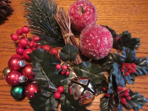 Holly Leaves and Berries, Bells, Ornaments and Cinnamon Sticks are Just a Few of the Things You Can Use to Decorate Your Basket