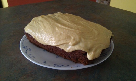 chocolate pumpkin cake in a  bread pan with pumpkin spice buttercream frosting 