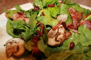 Thanksgiving Spinach salad with cranberries and pumpkin seeds  