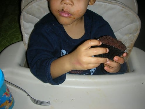 My son loving his cupcake