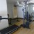 A tiny fitness center with a massive air conditioning unit.