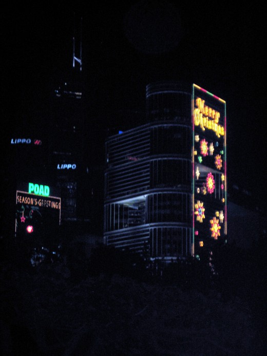 One of the many downtown buildings in Hong Kong decorated with beautiful Christmss Sceneries.