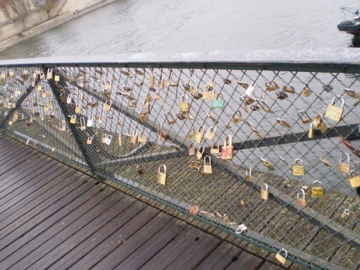 At the Pont des Arts Bridge, you can see many locks. These locks represent a promise of eternal love between couples.