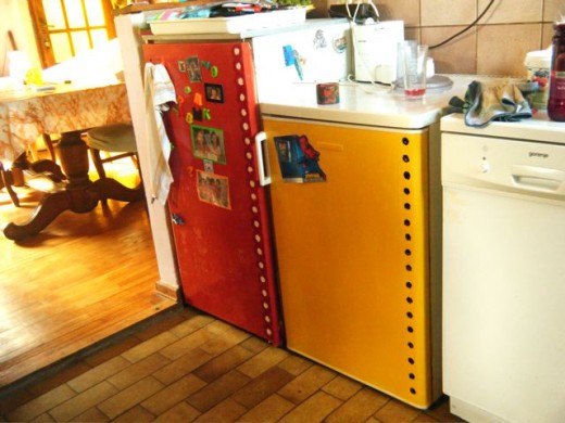 The polka dots on the fridges match the dots on the kitchen curtains!  Add a few magnets and pieces of art - Voila.  Plus a little clutter for authenticity!