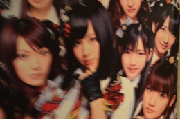 A blurry look at some AKB48 stuff plastered on the walls