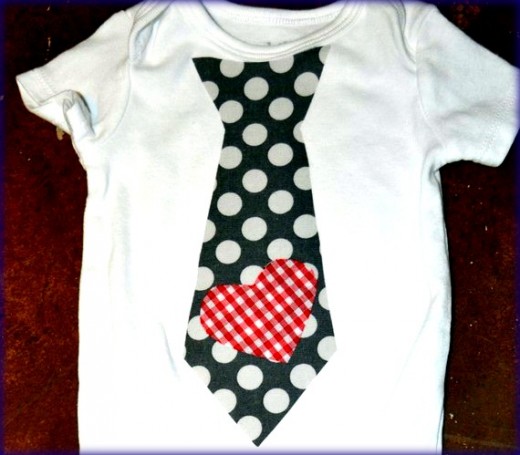 A onesie decorated with fabric applique