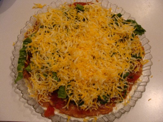 Followed by the shredded cheese.