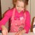 Grace carefully cuts the hole into the biscuit. Grace carefully cuts the hole into the biscuit.