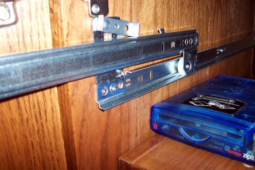 Mount the guide rails so the slide part will be the right distance below the top of the compartment - in this case it placed the shelf drawer six inches below the top of the compartment.