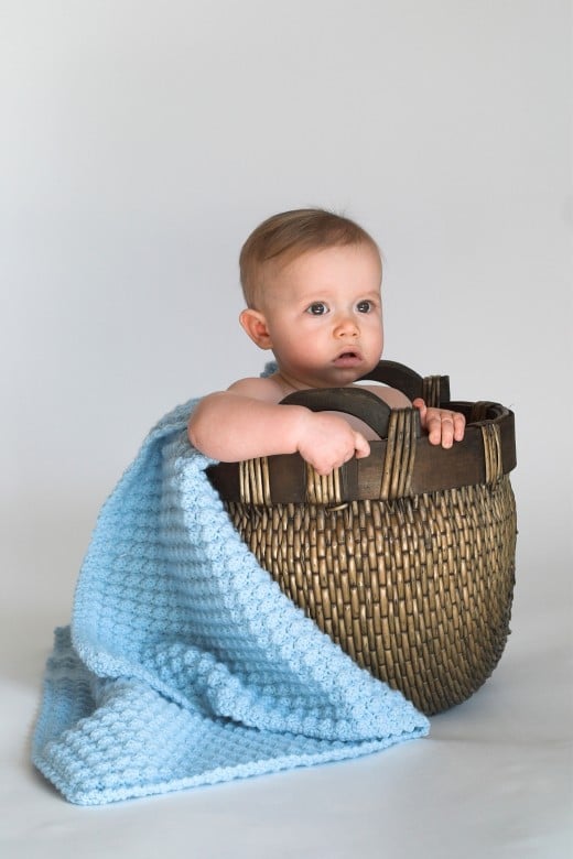 BASKET BABY by Beatricekillam DESCRIPTIONImage of cute baby sitting in a woven basket lined with a blanket 