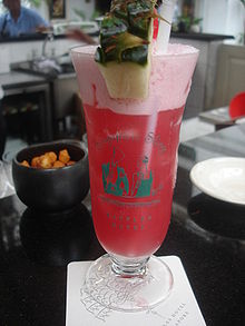 Usually served in a hurricane glass, the sling is a popular combination of Cherry Heering, gin, pineapple juice and Benedictine.  It was invented in Singapore at the Raffles Hotel Bar, about 100 years ago, where the drink is still served today.