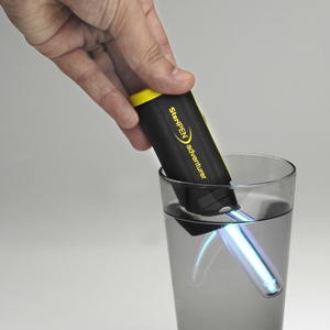 The Steripen Adventurer purifying a cup of water.