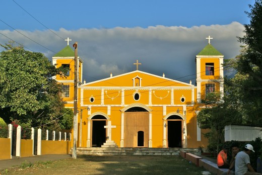 The Catholic Church in Moyogalpa.  The clouds behind are surrounding the crater of Concepción Volcano.  The street leading up to the church goes to the port and there are many shops.  I got a cheap haircut there.