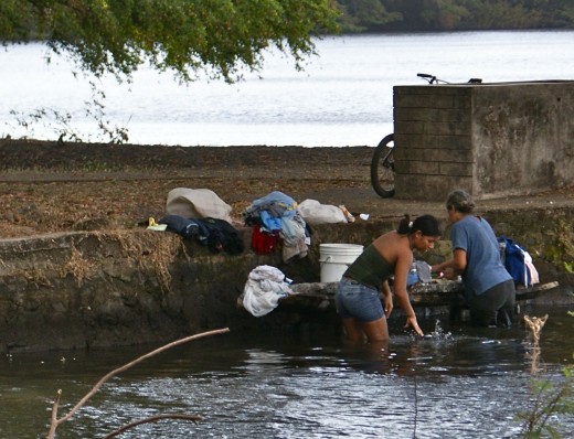 Women washing clothes along the shores of Lake Nicaragua near Charco Verde.  