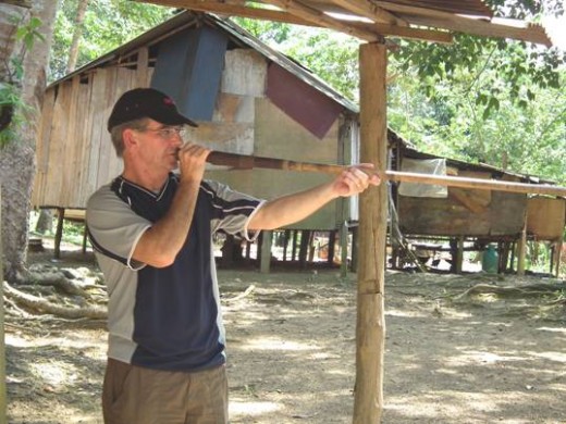 Taking aim with an Orang Asli Blowpipe