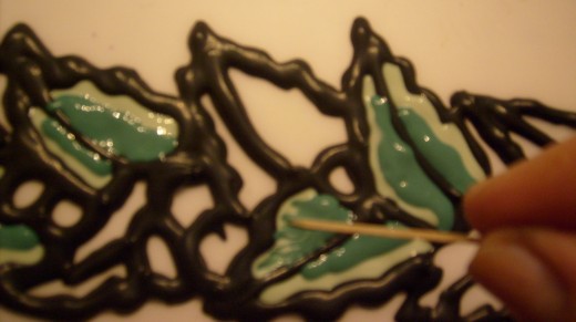 Use toothpick to draw lighter green into ivy green.