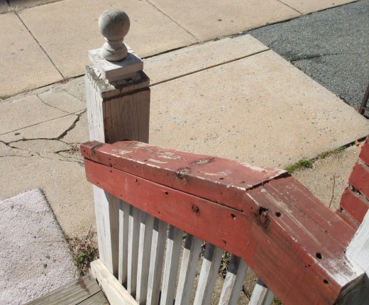 Outside banister of a foreclosed house.