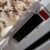 The Sync button on the Nintendo Wii is located inside of a compartment on the front of the console. The Sync button on the Nintendo Wii is located inside of a compartment on the front of the console.