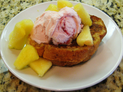 Strawberry ice cream and fruit on top of french toast...now that sounds like breakfast!