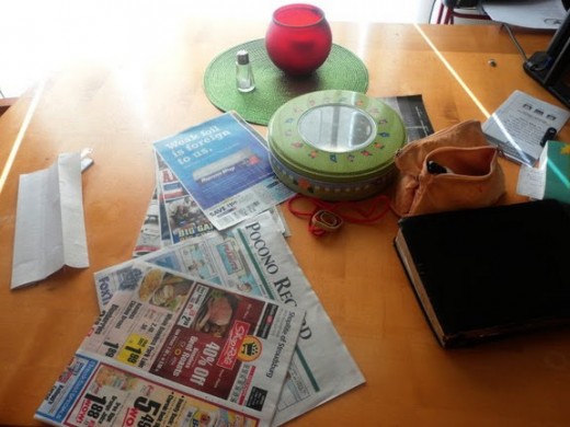 This is my table before clearing. Doesn't look too bad but everything here collected between last night's dinner and this morning after the kids left for school. Two more days of this and the entire table will be covered.