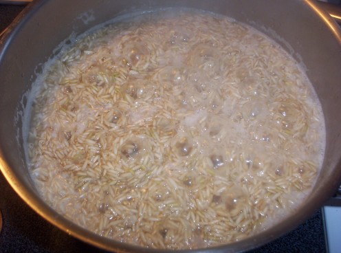 Allow the rice to simmer until little craters form in the rice.