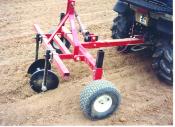 Three Point Hitch with a row builder attached to a fifth wheeled adapter for use on garden tractor or ATV.