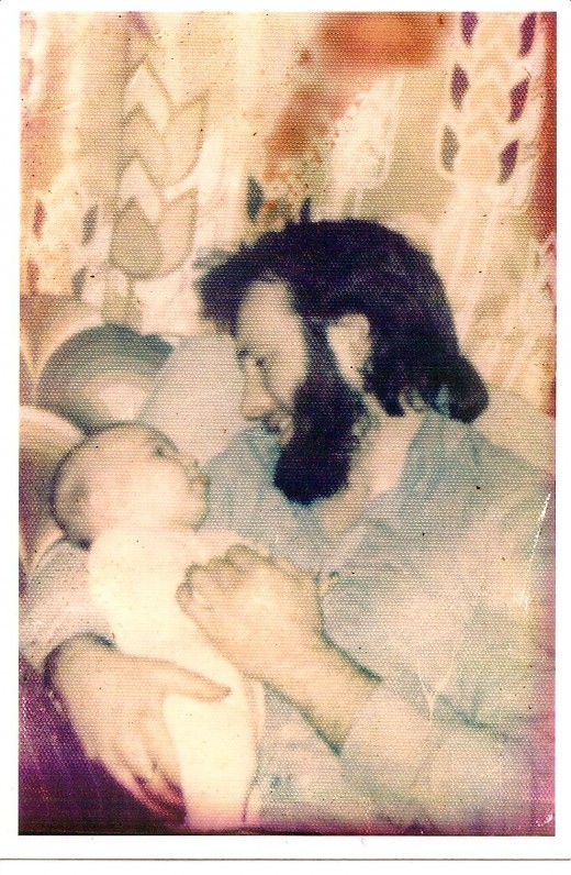 Dave with our baby daughter 1974