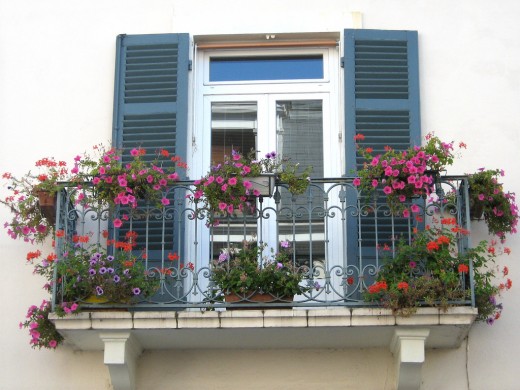 Beautiful window shutters on a balcony in France.