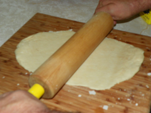 After pressing the dough in a 9 inch pie dish, roll it out close to 16 inches, but slightly under.